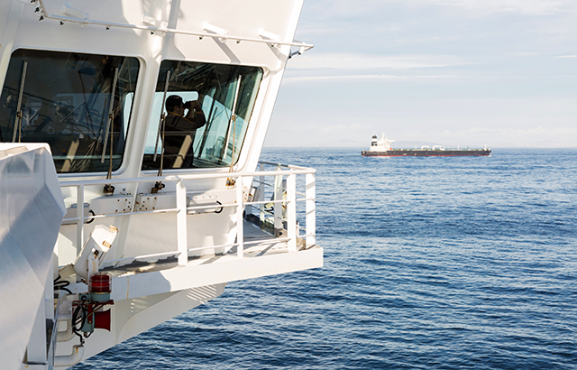 Navigation bridge of oil tanker with watch officer