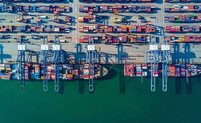 container ship in import export and business logistic by crane